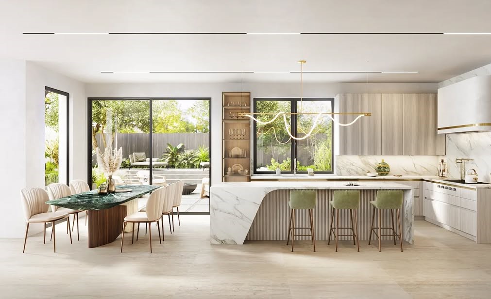 Open kitchen dining room with marble island, wood details, pendant lighting, garden views