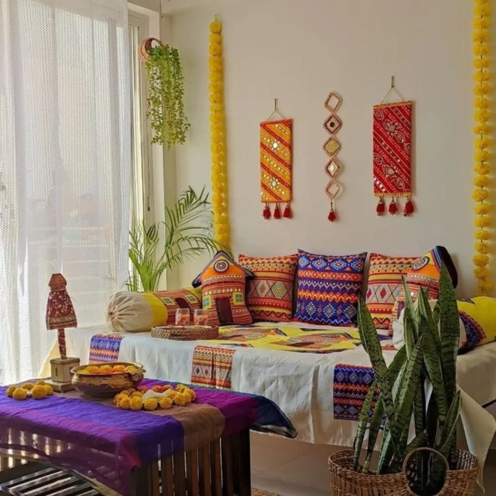 Colorful boho seating area with traditional textiles and flowers