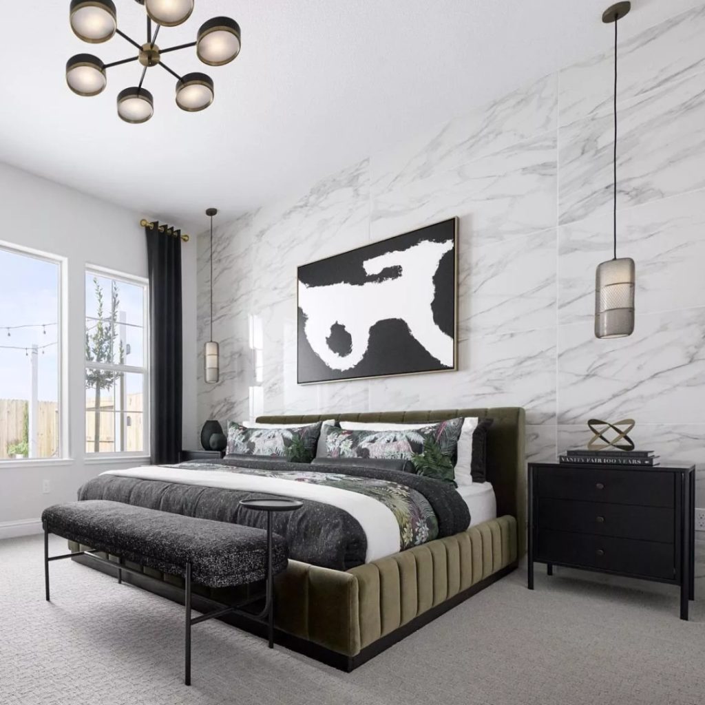 Contemporary bedroom with marble walls and modern lighting fixtures