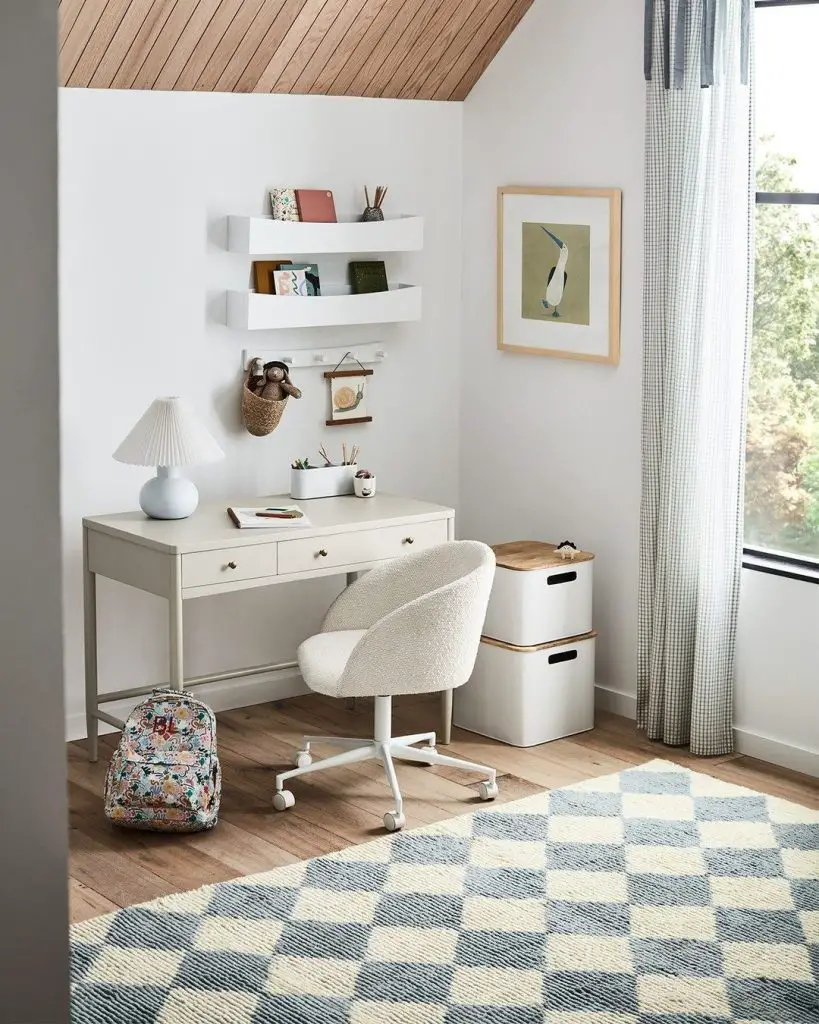 Attic study space with wood ceiling and white desk
