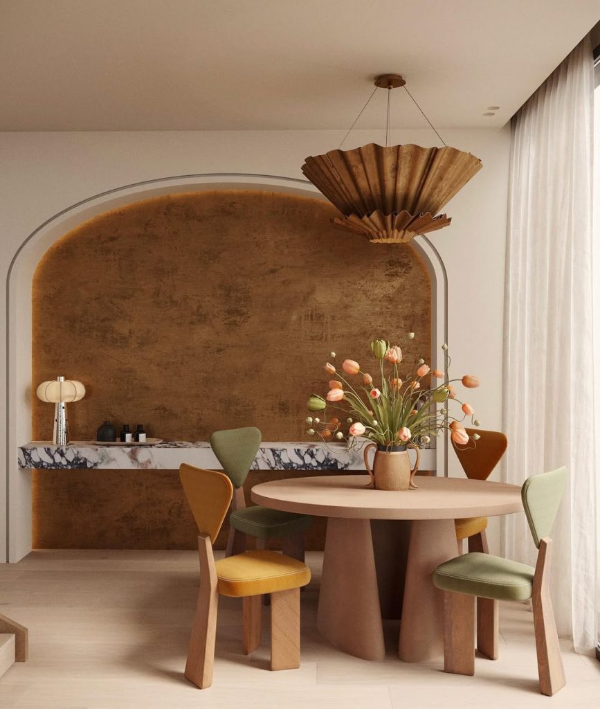 Curved dining nook with colorful chairs and pendant lighting