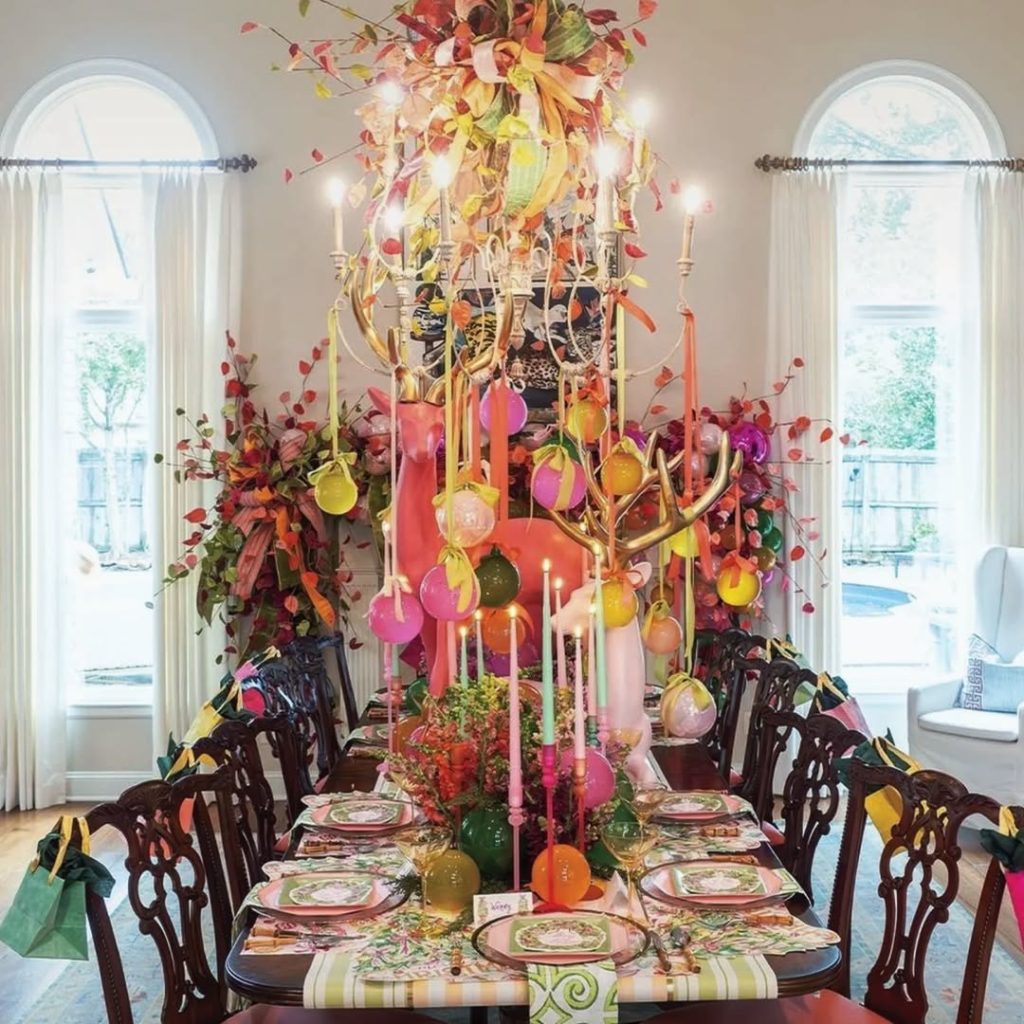 Elegant dining room with autumn leaf chandelier and formal table setting