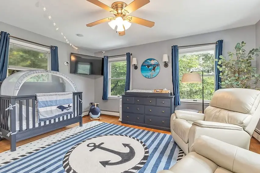 Built-in coastal bunk beds with sage green and white decor