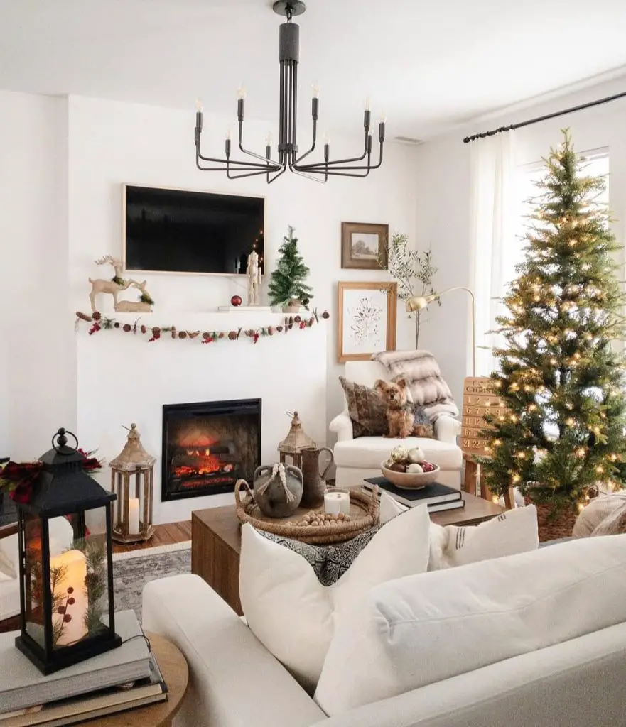 Neutral living room with fireplace Christmas tree and cozy holiday decorations
