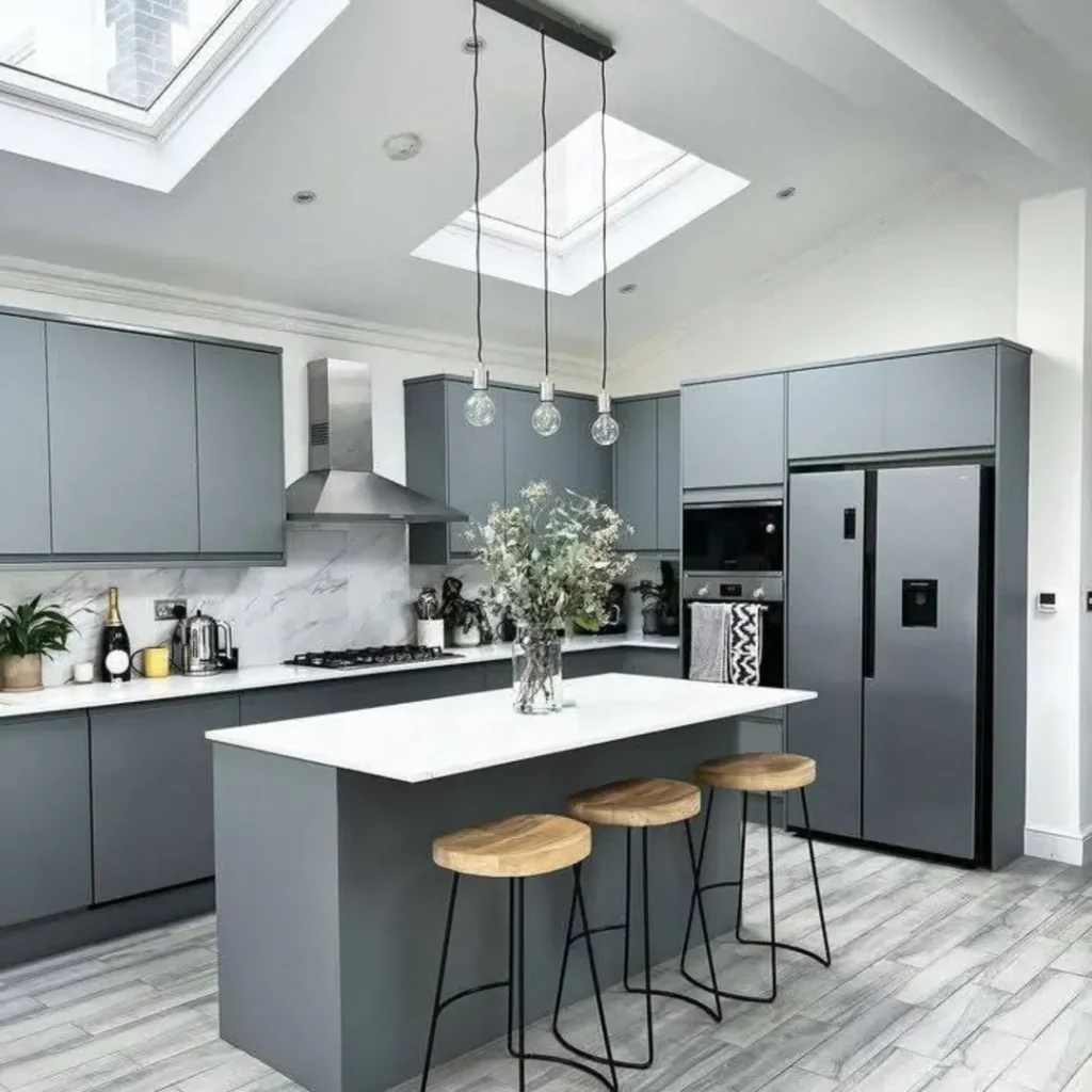  Gray kitchen with skylights white countertops and crystal pendants