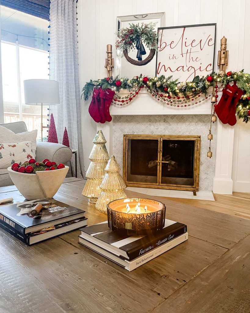 Modern Christmas mantel with gold trees and believe sign