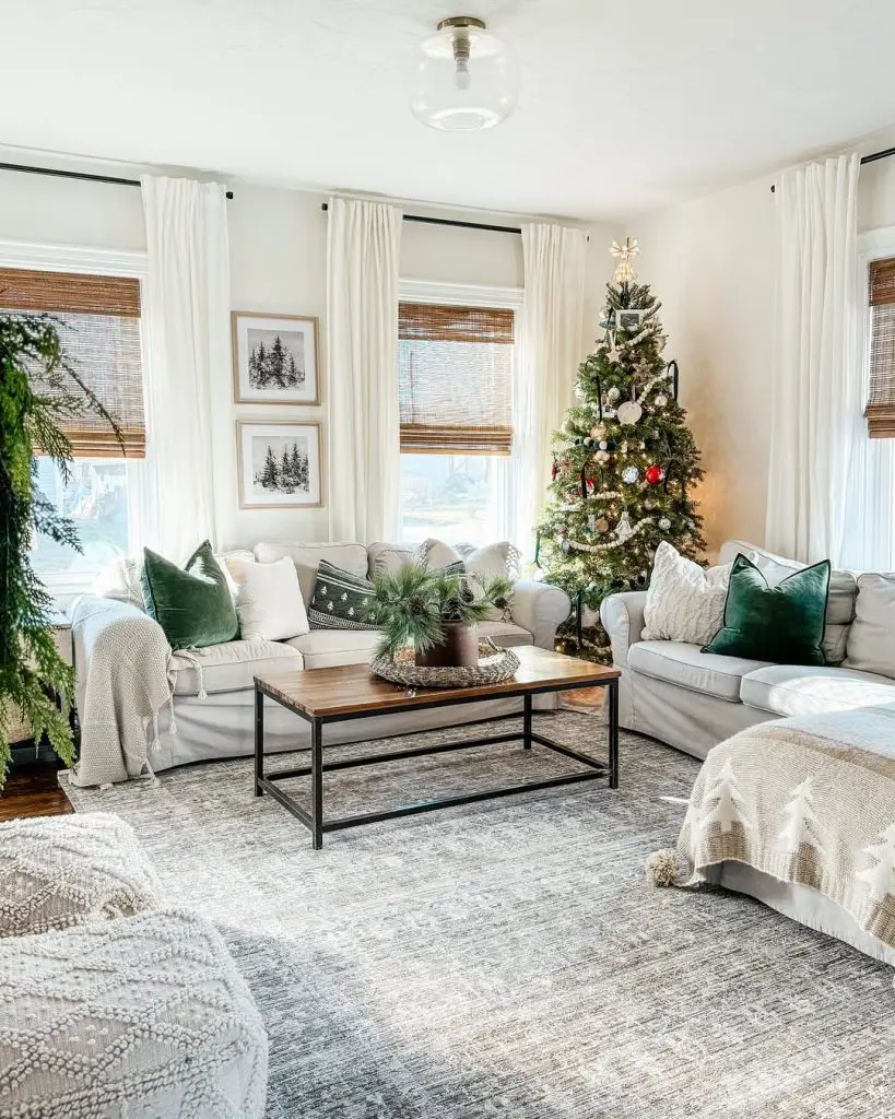 Rustic living room with red Christmas decorations and stone fireplace