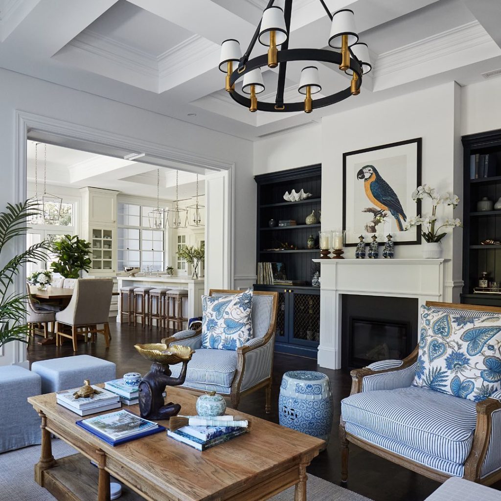 Traditional living room with blue striped chairs and fireplace