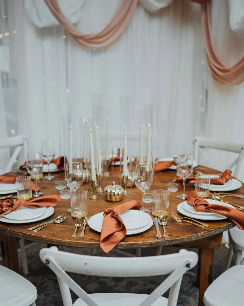 Rustic copper Christmas table with reindeer candles pine decorations
