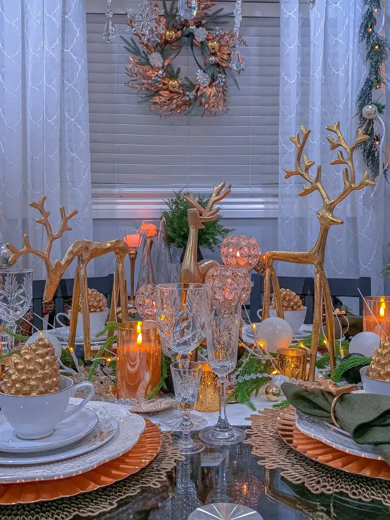 Elegant Christmas table with copper chargers and crystal glasses.