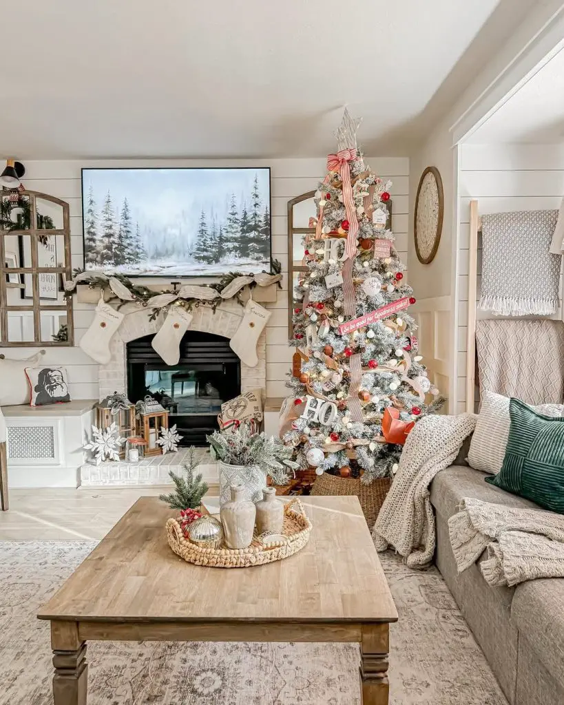 Farmhouse living room with flocked Christmas tree and shiplap walls