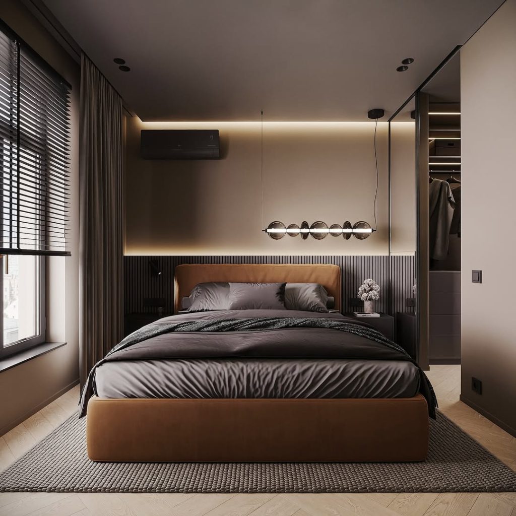 Dark accent bedroom with pendant lighting and wardrobes