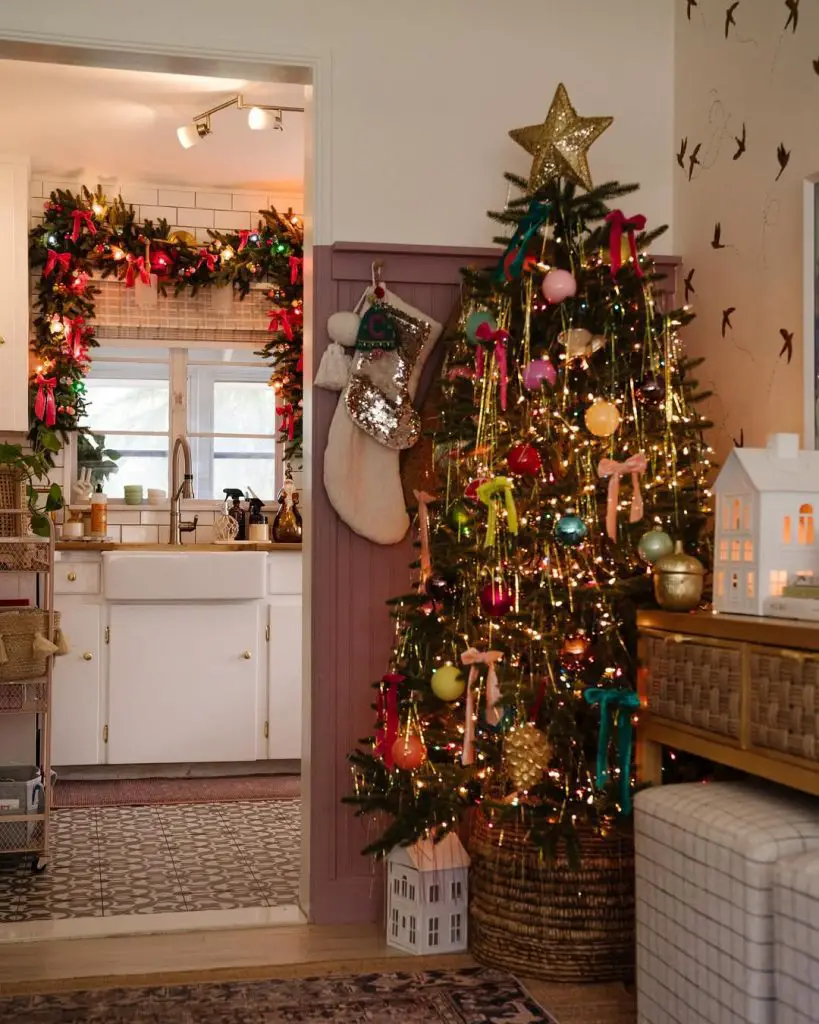Farmhouse Christmas corner with tree in basket, stockings, bird wall decals, modern rustic decor