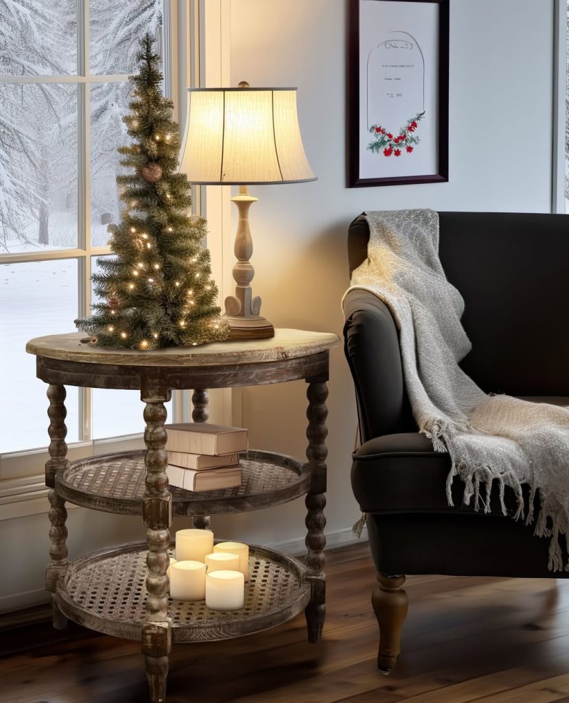 Small Christmas tree with lights on wooden table