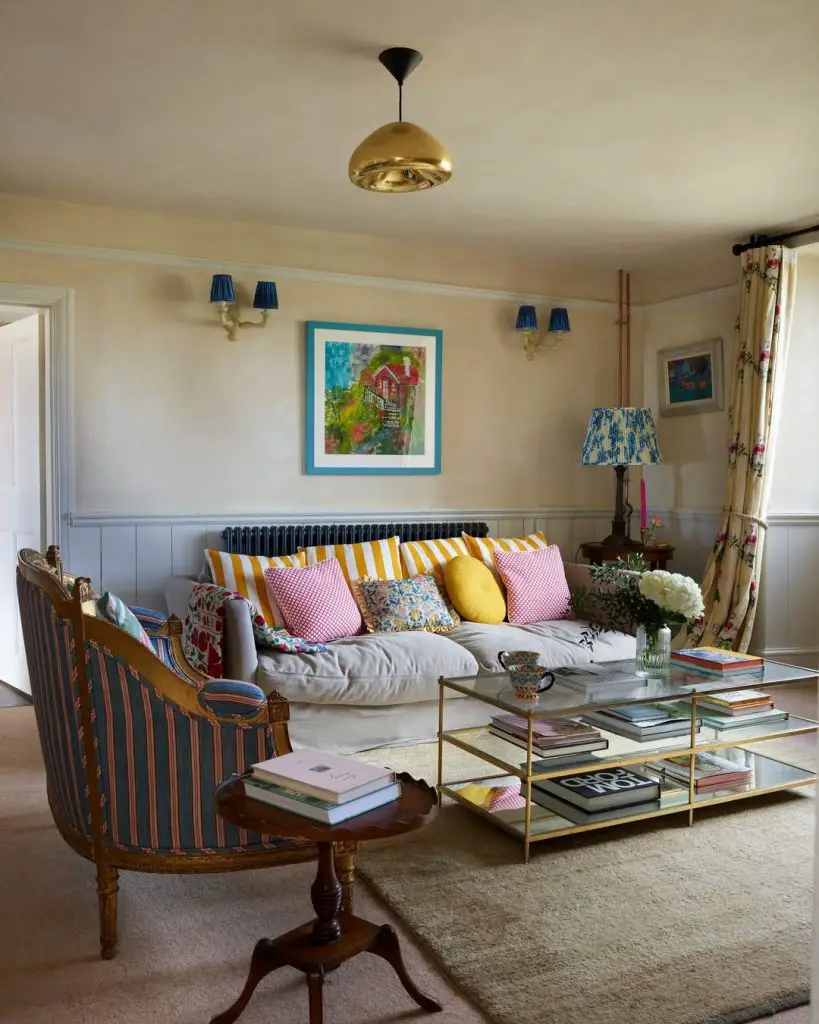 Elegant green living room with twin sofas and mirrors