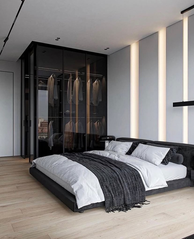 Black and white bedroom with glass closet