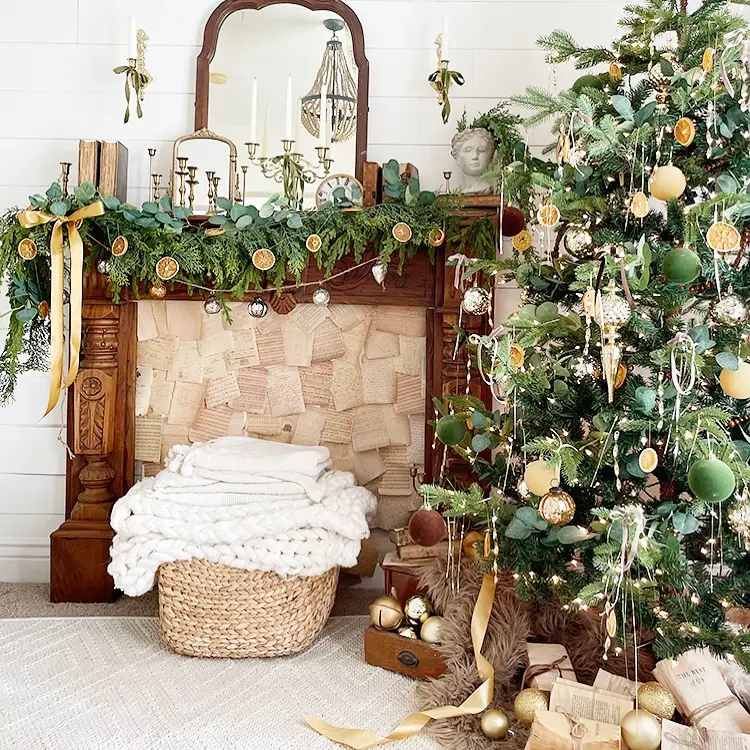 Christmas tree with dried oranges, golden ribbons, vintage furniture, natural holiday decorations
