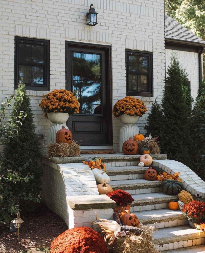 Front porch decorated with pumpkins mums autumn