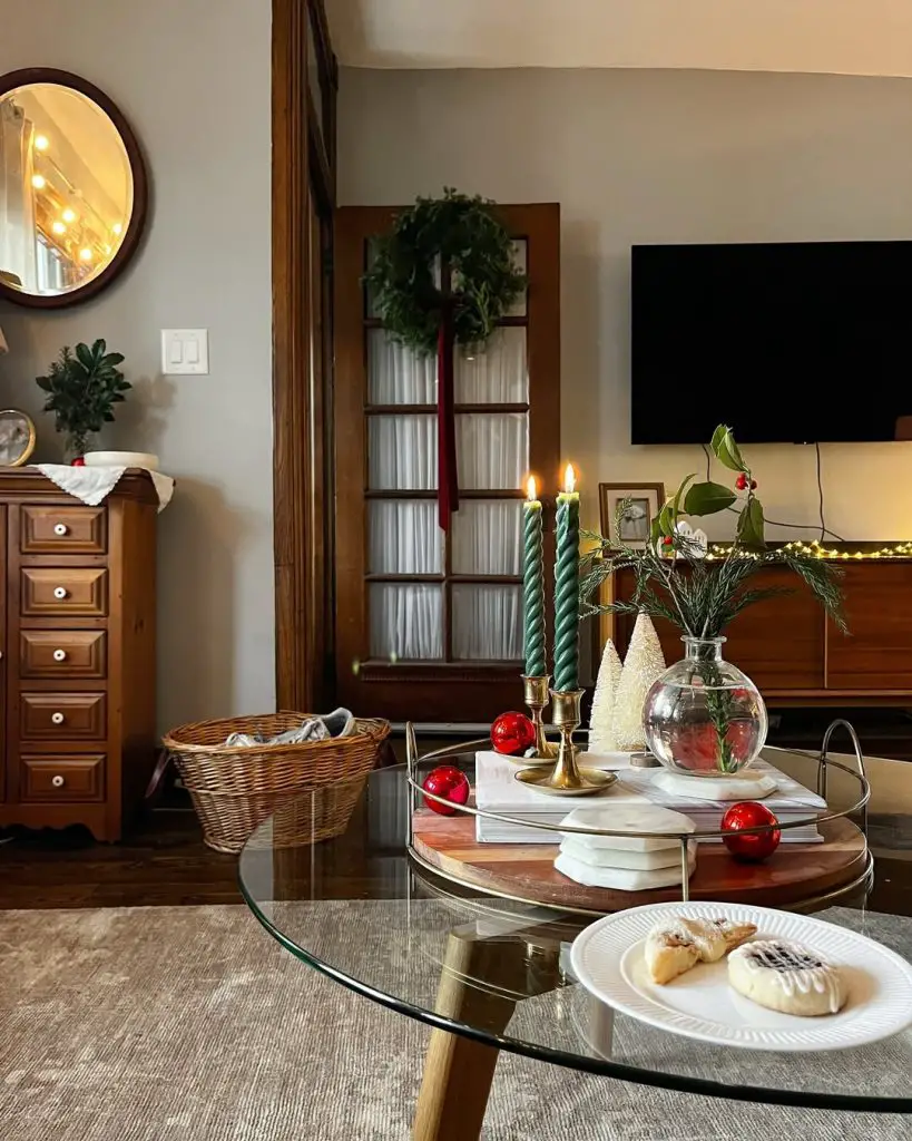 Warm living room with Christmas wreath and holiday candles