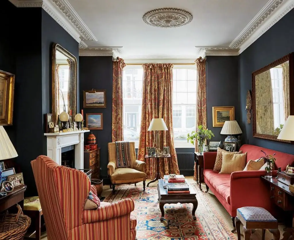 Navy blue traditional living room with red leather furniture