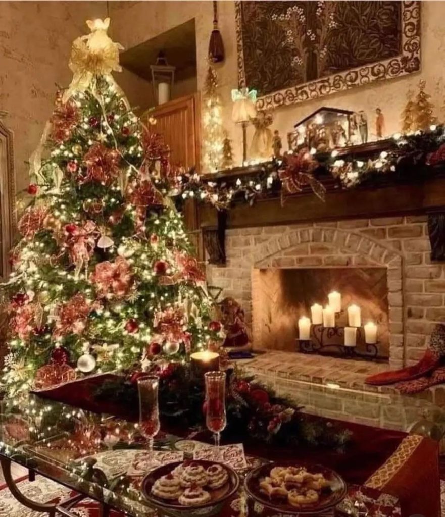 Traditional Christmas room with stone fireplace decorated tree and holiday treats