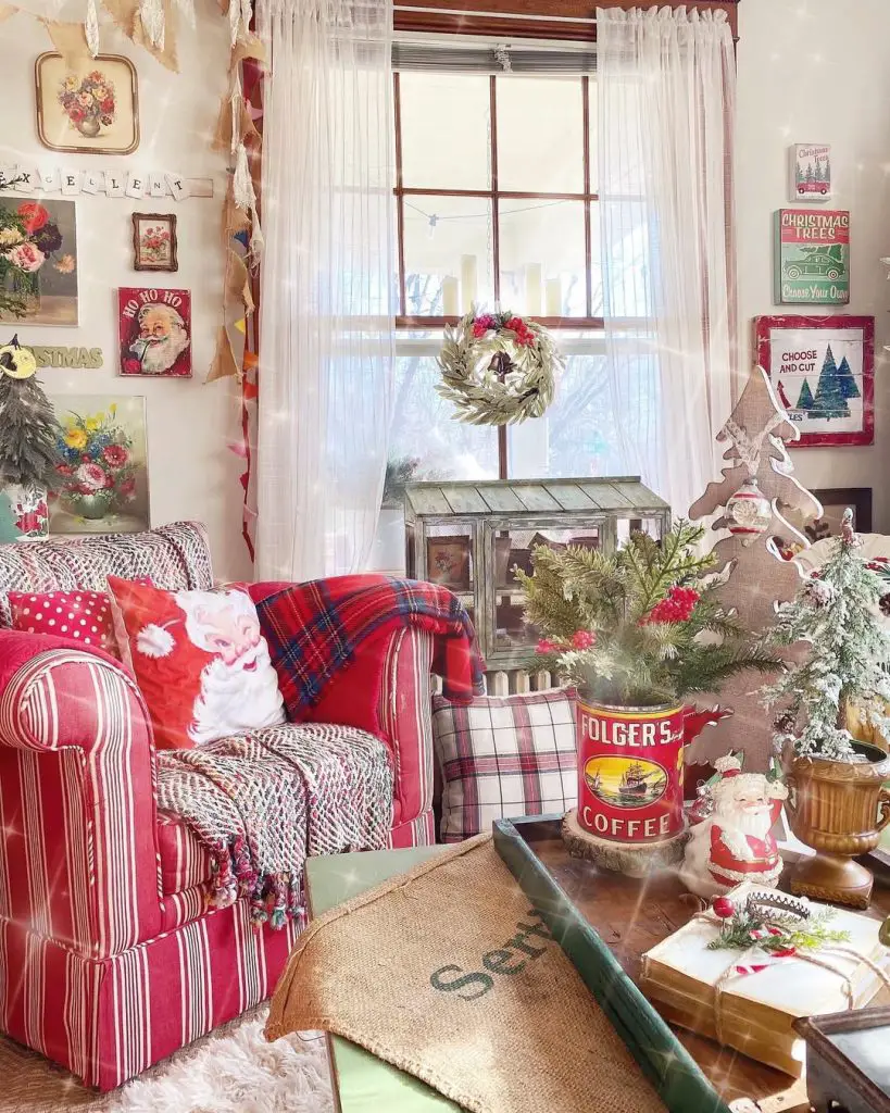 Cottage Christmas room with plaid textiles, vintage signs, striped chair, holiday decorations
