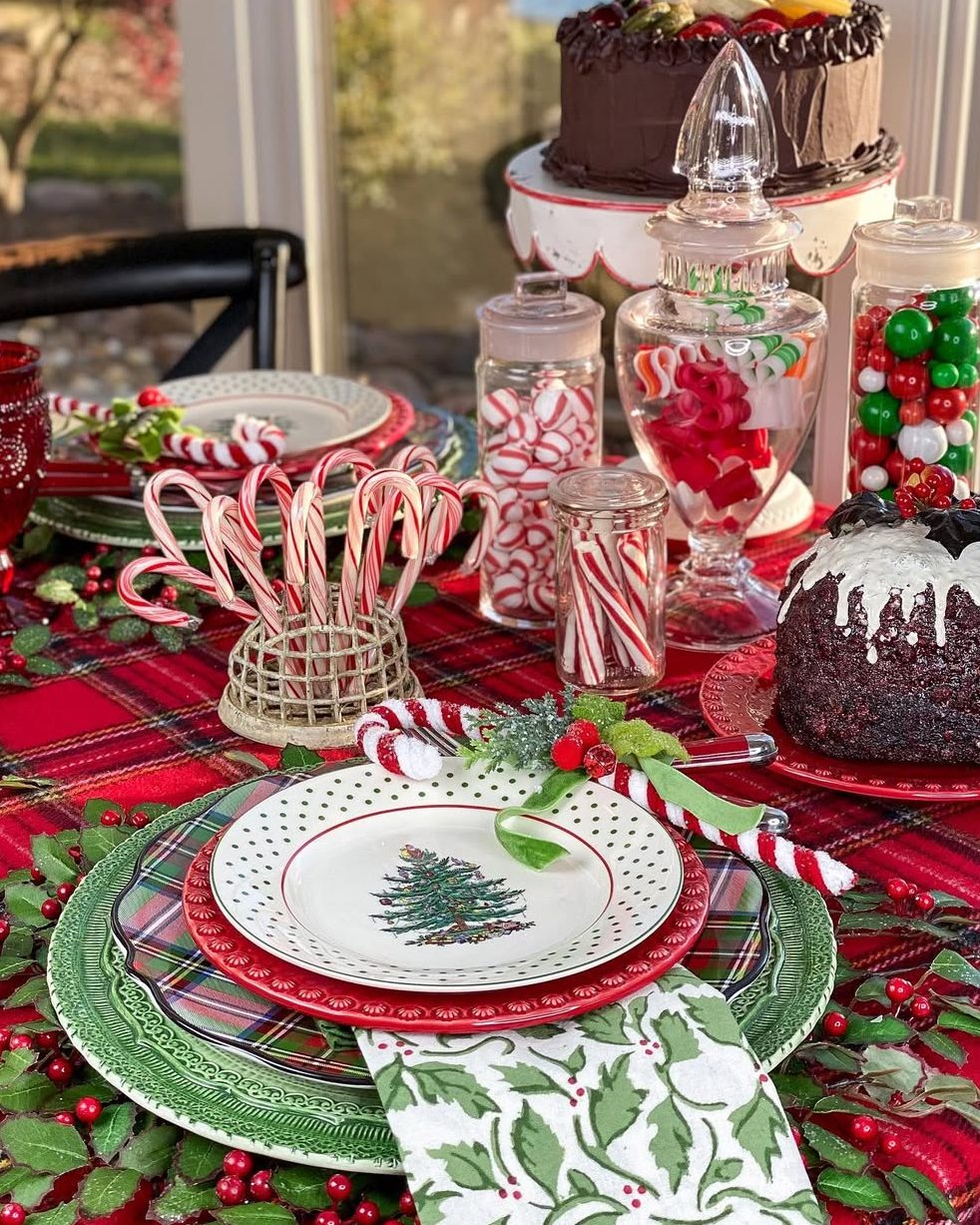 Green Christmas table with natural wood and fresh greenery