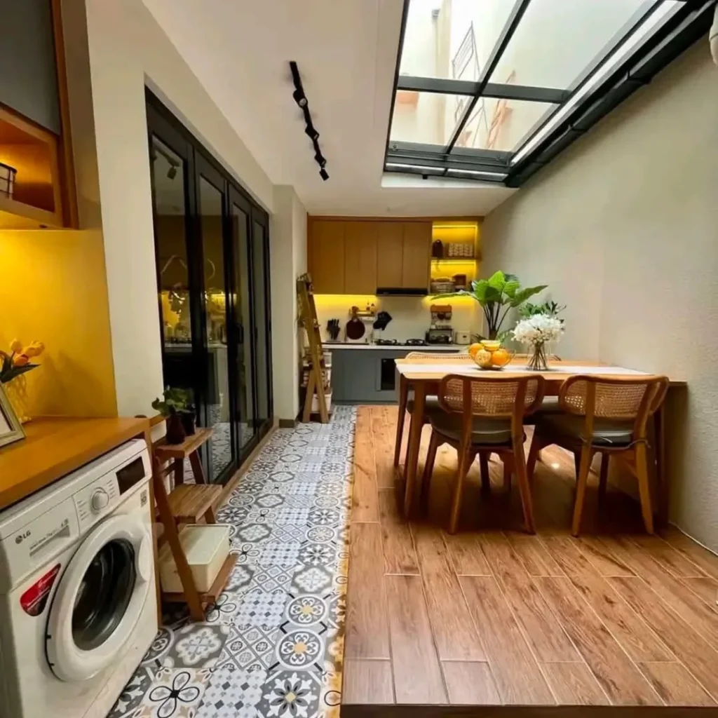 Narrow kitchen with glass ceiling patterned tiles and wood dining