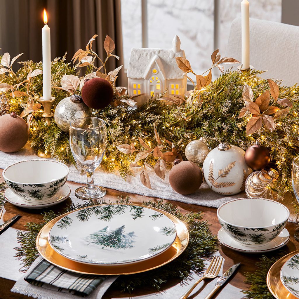Red striped Christmas table with white flowers and candles