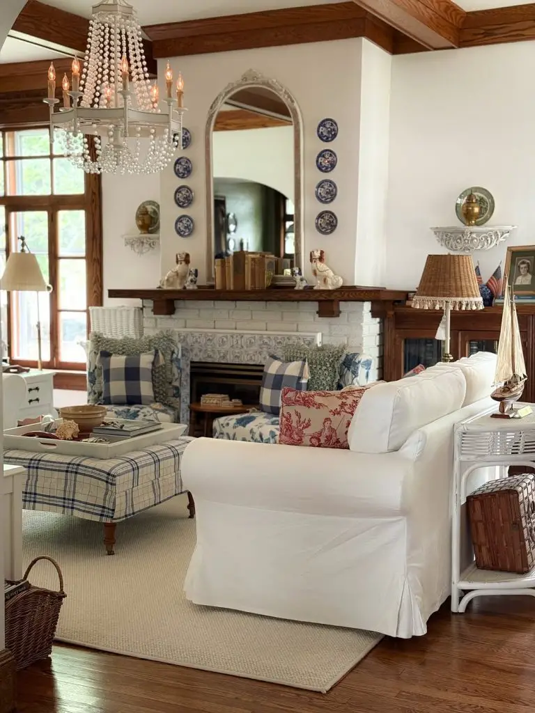 Traditional cottage living room with burgundy sofa and fireplace