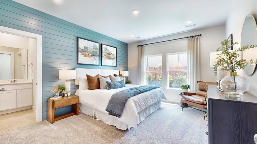 Blue bedroom with shiplap accent wall and modern styling