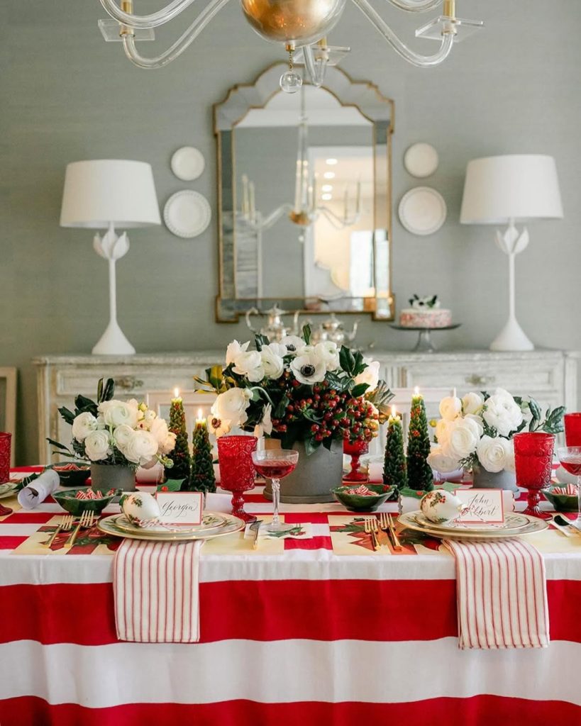  Elegant dining room with red white striped linens and holiday centerpiece