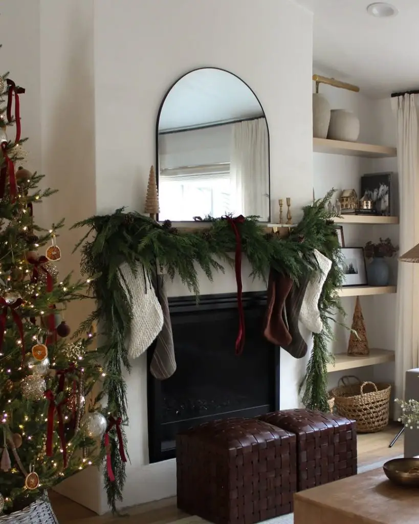 Contemporary Christmas room with neutral tree and modern fireplace