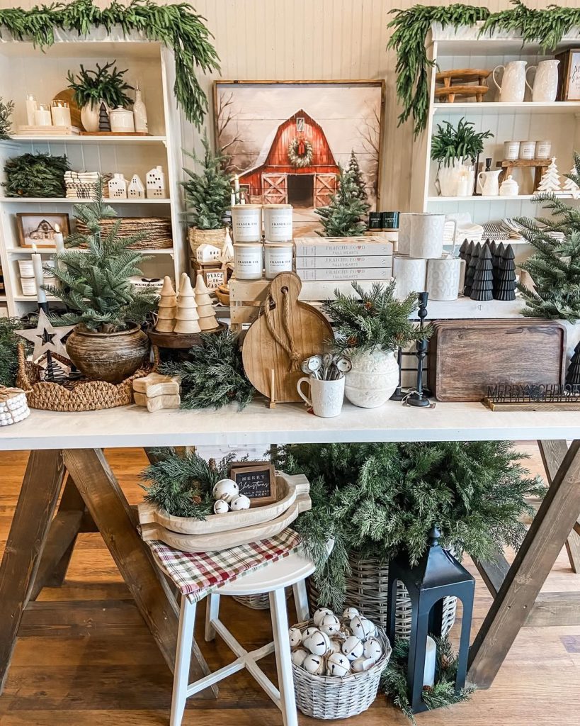 Wooden table with Christmas decorations barn artwork garland