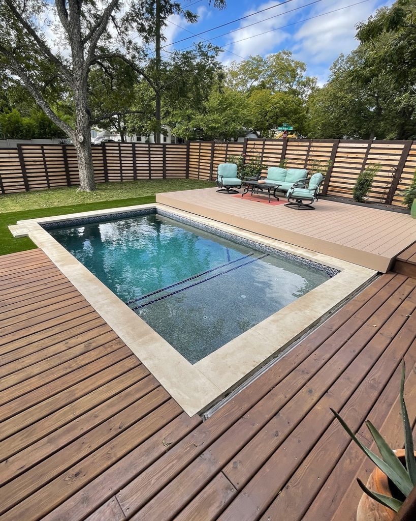 Rectangular pool with modern horizontal fence and composite decking