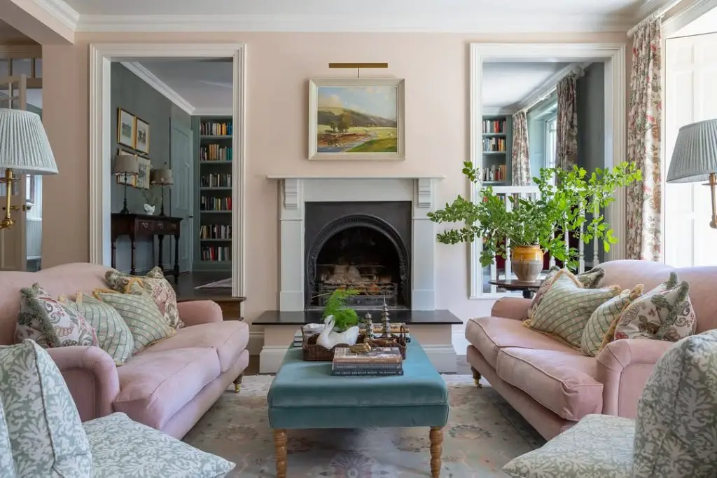 Country farmhouse living room with brick fireplace and wooden beams