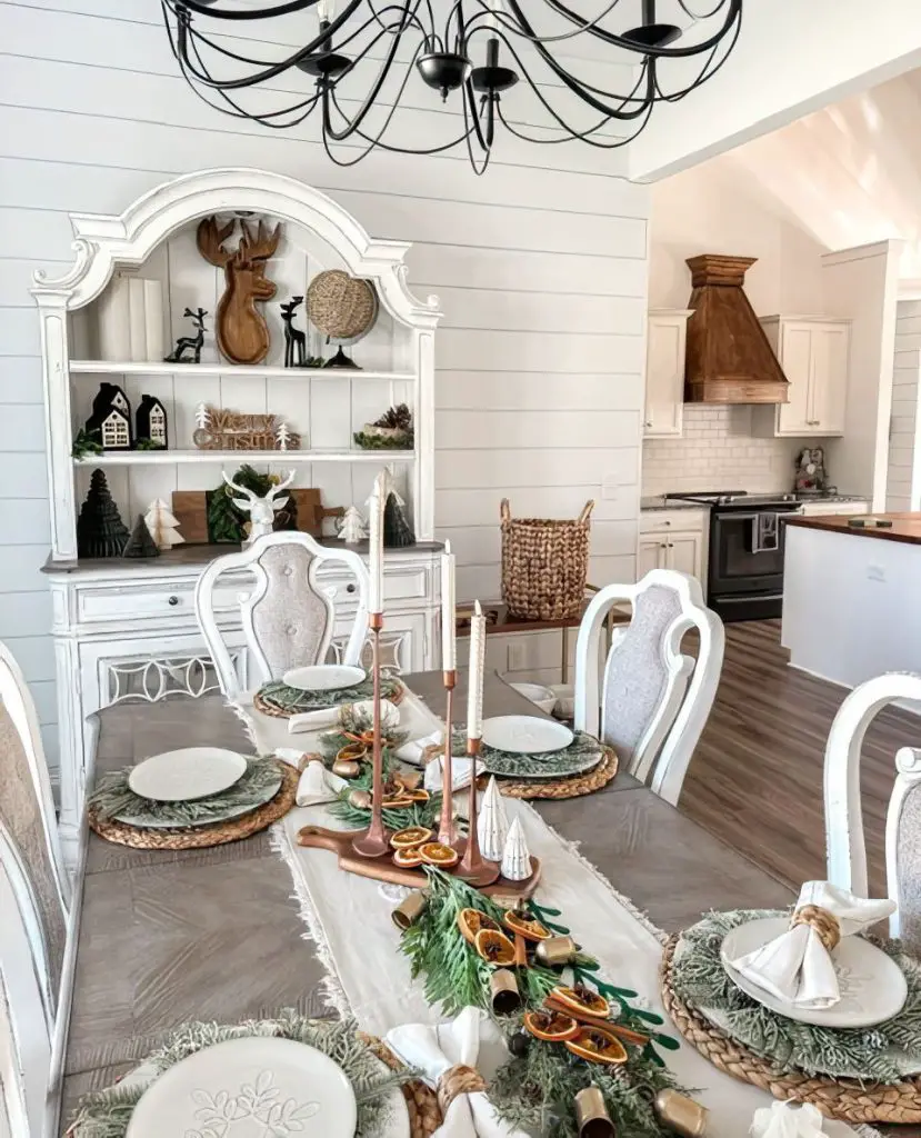 Rustic Christmas table with plaid plates and natural wood textures