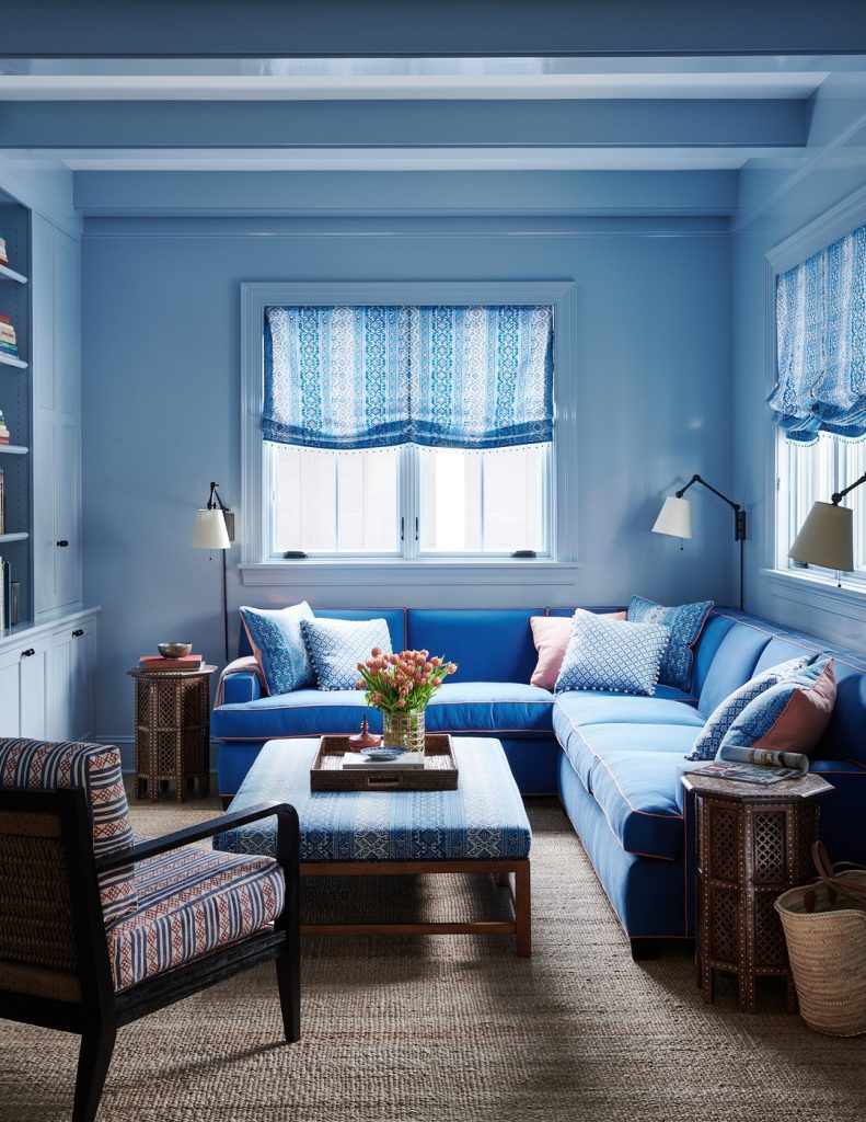 Small blue living room with built-in seating and storage