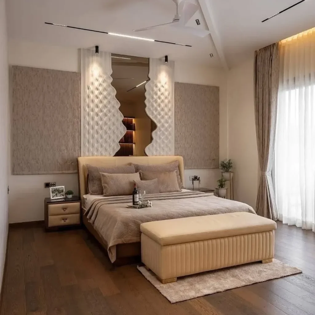 Bedroom with sculptural white headboard and neutral tones