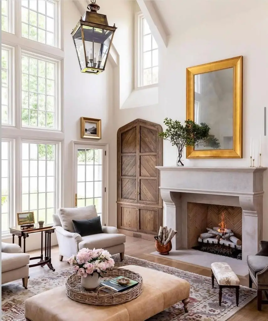  White paneled living room with floral painting and country decor