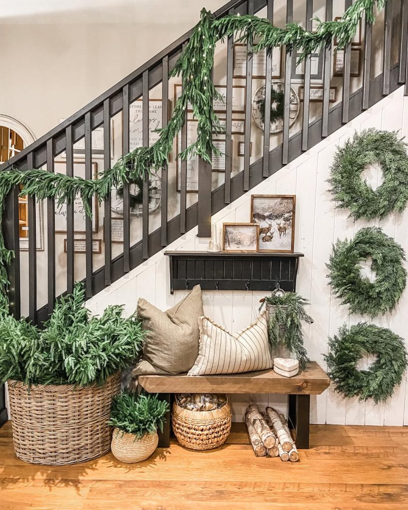 Stairway with black railing Christmas wreaths and garland