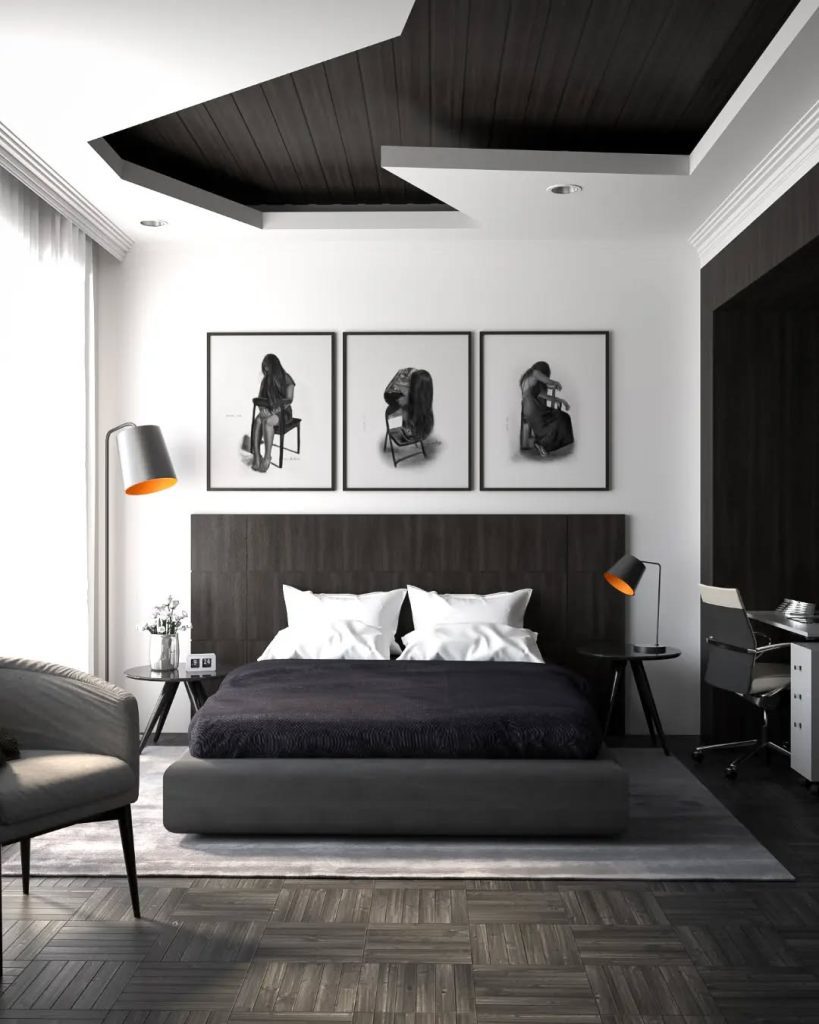 Black and white bedroom with coffered ceiling and artwork