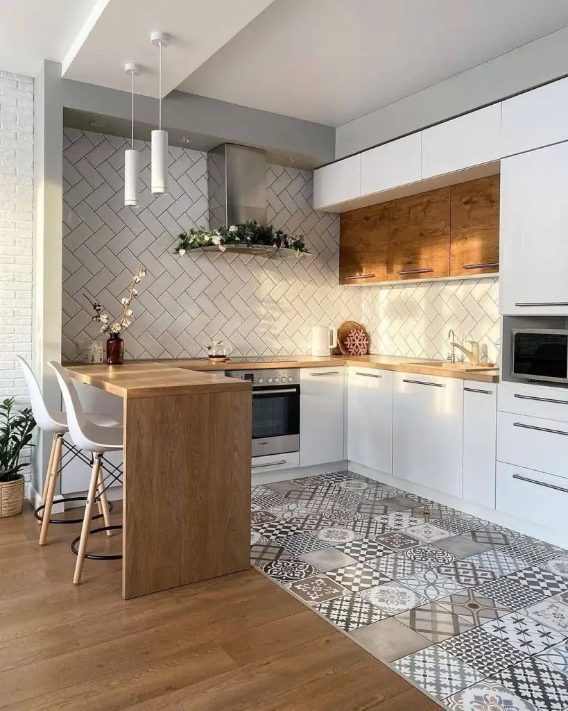 Modern white kitchen with herringbone backsplash patterned floor tiles