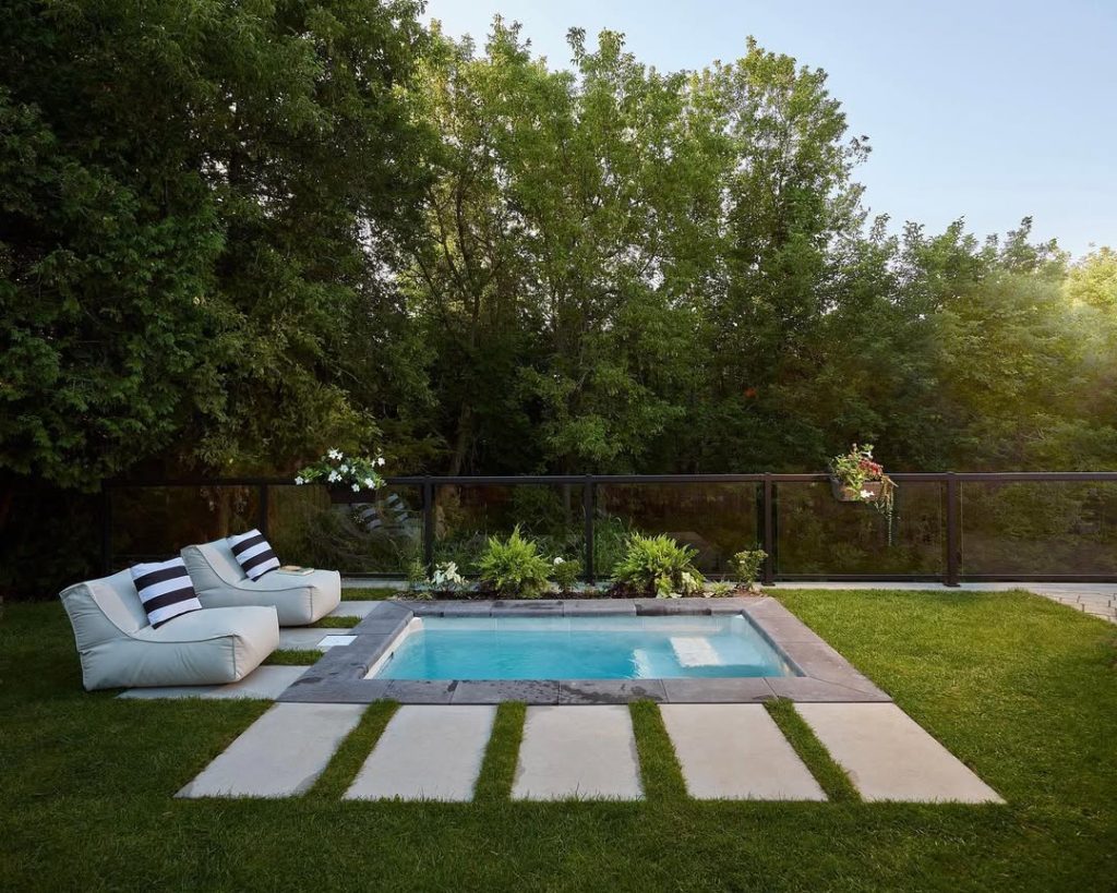 Small pool with modern seating and geometric stone paving