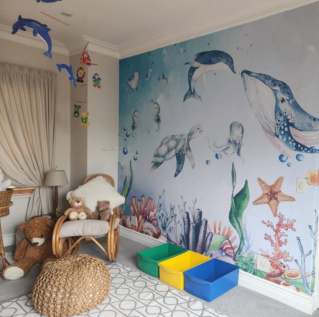 Immersive ocean nursery with full wall murals and sea creatures