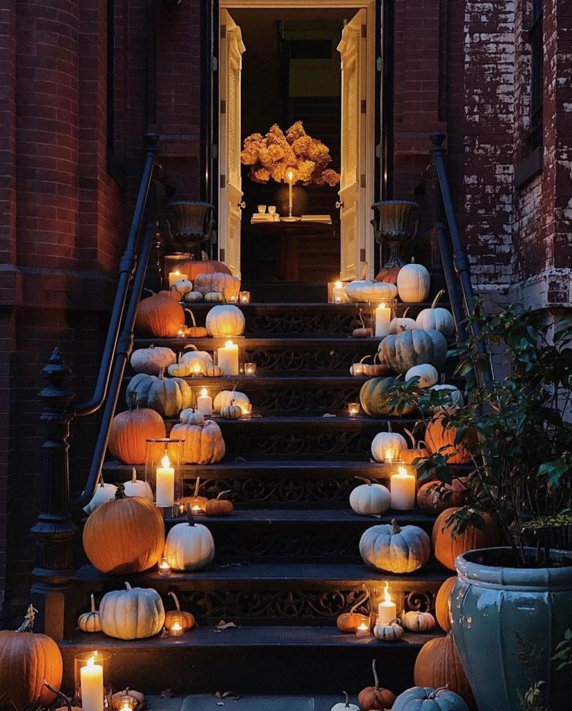 Elegant stairway with pumpkins candles autumn decoration
