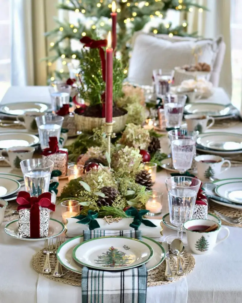 Christmas table setting with tree-pattern china, wicker chargers, and holiday centerpiece