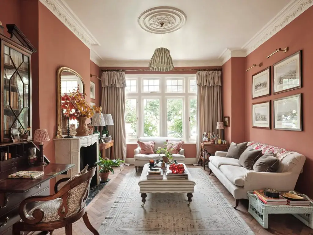 Yellow living room with leopard ottoman and pendant lights