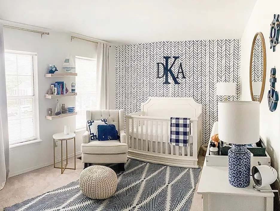 Navy striped nursery with whale tail decor and rope accents