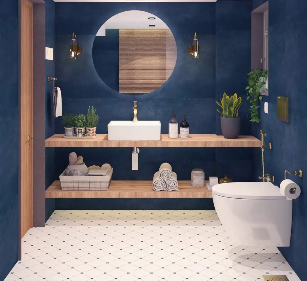 Navy blue powder room with wood vanity and circular mirror